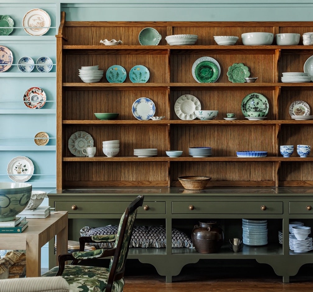 a shelf with plates and bowls on it